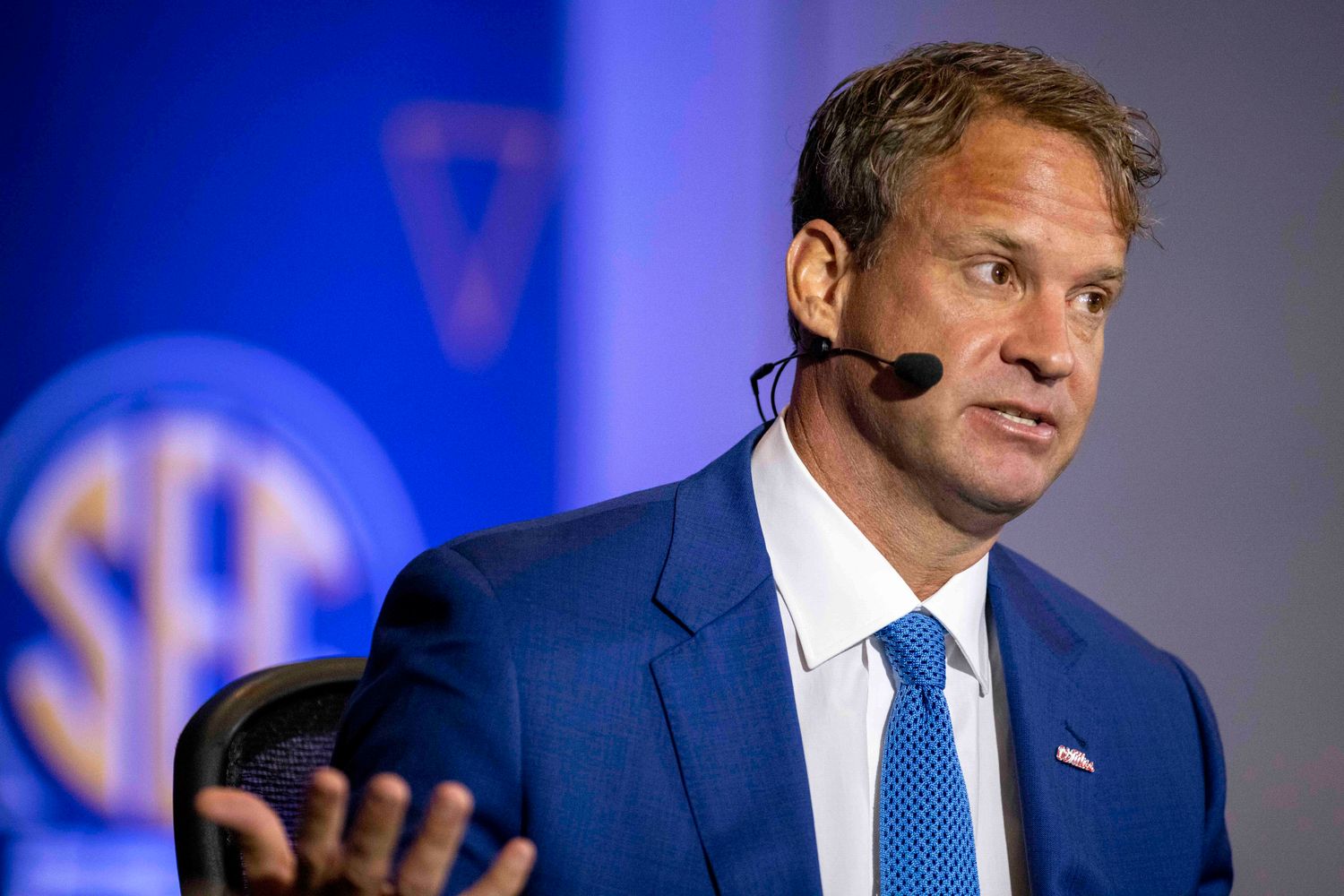 Jul 20, 2021; Hoover, Alabama, USA; Ole Miss Rebels head coach Lane Kiffin talks with SEC Network personality Paul Finebaum (not pictured) during SEC Media Days at Hyatt Regency Birmingham. Mandatory Credit: Vasha Hunt-USA TODAY Sports